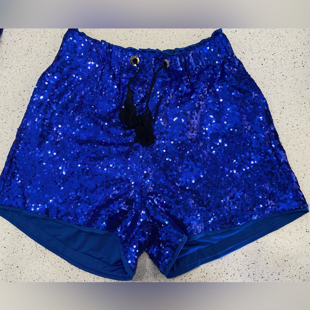NWOT, blue sparkly shorts. size M